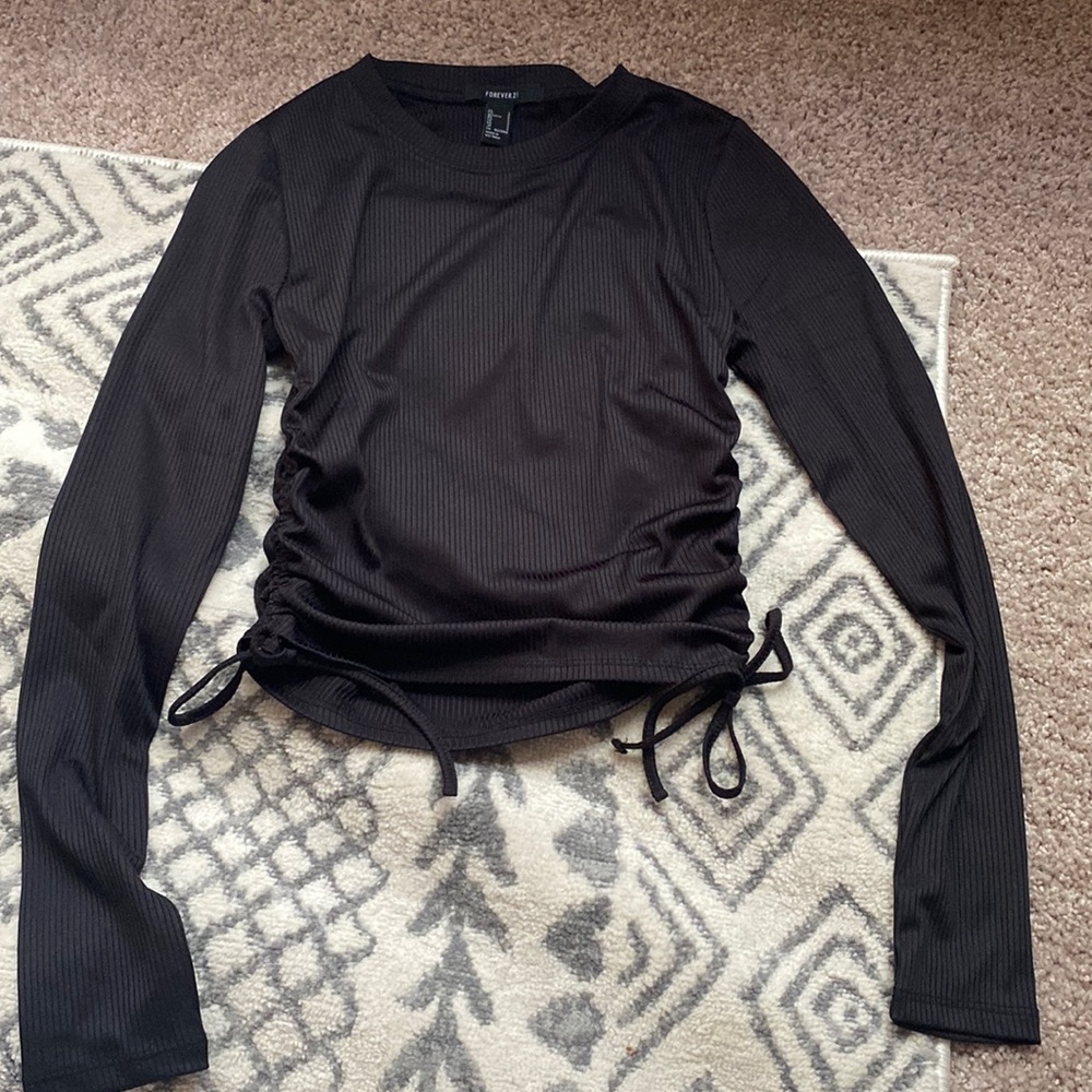 Cropped black top with draw string detail on sides.